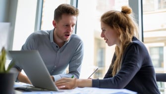 Subject a person coaching another person during their projectDescription 1 person coaching another person on a business project
